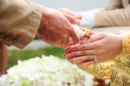 Blessed water at Thai wedding ceremony in Thailandの写真素材