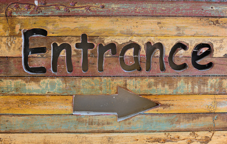 entrance sign on wood, natural backgroundの写真素材