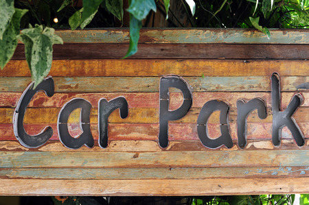 carpark sign on wood, natural backgroundの写真素材