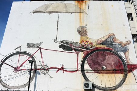 GEORGE TOWN, PENANG, MALAYSIA - MAY 12 2014  Street Mural tittle  The Awaiting Trishaw Peddler  painted by Ernest Zacharevic in Penang Road, in conjunction with the 2012 George Town Festival のeditorial素材