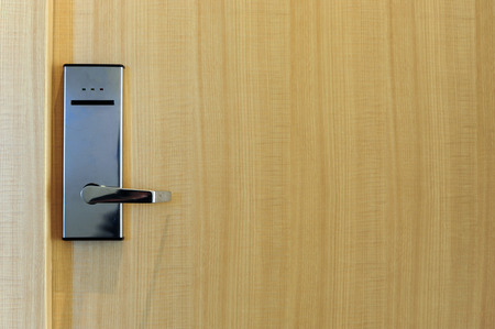 Hotel electronic lock on wooden doorの写真素材