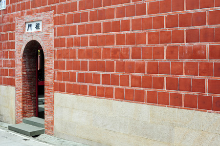 Red Chinese Buddhist temple exterior wallのeditorial素材