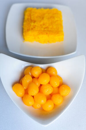 Gold egg yolks dropsの写真素材