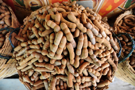 Fresh Tamarind in Basket for sellの写真素材