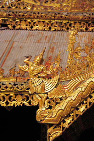 LAMPANG, THAILAND - NOVEMBER 18 : Golden Pagoda and Sculpture of the mythical god in temple Chedi Sao in Lampang, Thailand, November 18, 2014. Church was built in 15th centuryのeditorial素材