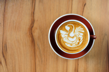 Swan drawing on latte art coffee cupの写真素材