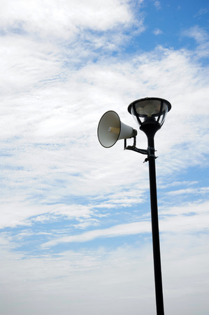 Black Pole and Lamp with White Loudspeakerの写真素材