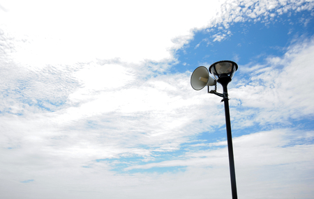 Black Pole and Lamp with White Loudspeakerの写真素材