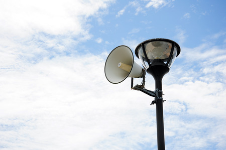 Black Pole and Lamp with White Loudspeakerの写真素材