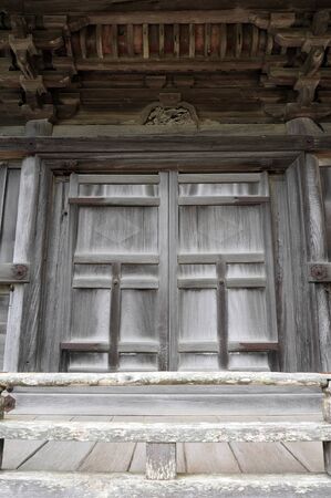 Old wooden door in The Japanese shrineの写真素材