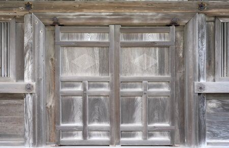 Old wooden door in The Japanese shrineの写真素材