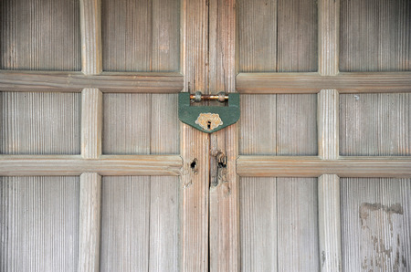 Traditional Japanese wooden door with old lockの写真素材