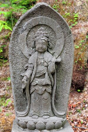 MATSUSHIMA, JAPAN - JULY 8, 2015 : Buddhist statue located along the entrance to the Zuiganji Temple in Matsushima. The area is considered one of the Three Most Scenic Spots in Miyagi District , Japanのeditorial素材