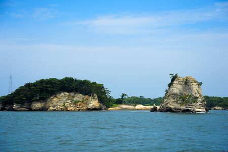 Spectacular coastline in Matsushima, traditionally regarded as one of the three best sights in Japan, beautifully shaped rocks covered with pines.の写真素材