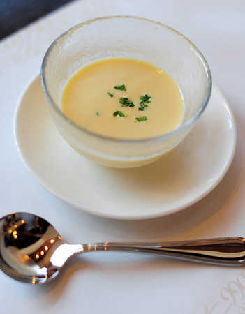 Corn soup in a white dishの写真素材
