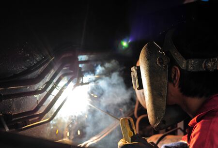 Welder and bright sparks. Production and constructionの写真素材