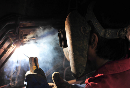 Welder and bright sparks. Production and constructionの写真素材