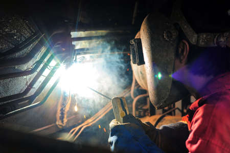 Welder and bright sparks. Production and constructionの写真素材