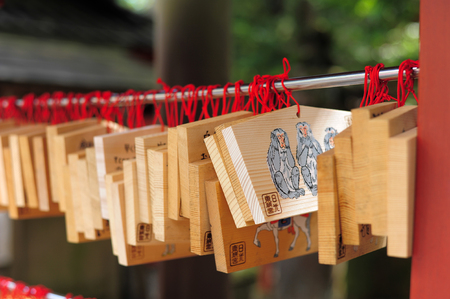 NIKKO, JAPAN - OCTOBER 6,Wooden plate of Three wise monkey in Toshogu shrine Nikko, Japan on October 6, 2015. Shrine visitors write their wishes on wood plates and leave them inside the Toshogu shrine in the hope that their wishes come true.のeditorial素材