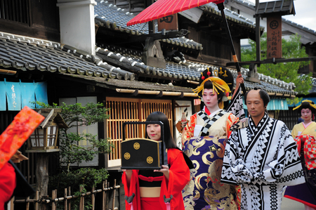 NIKKO, JAPAN - OCTOBER 6, 2015: Geisha parade at Edo Wonderland in Nikko Edomura Edo Wonderland is a history theme park recreating Japanese town life during the Edo Period 1603-1868.のeditorial素材