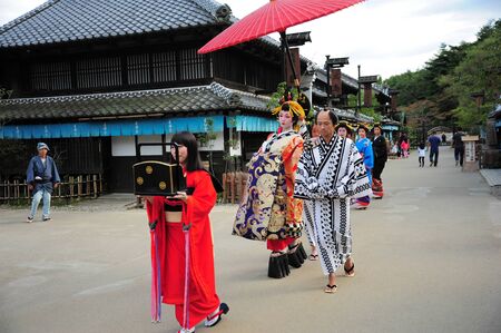 NIKKO, JAPAN - OCTOBER 6, 2015: Geisha parade at Edo Wonderland in Nikko Edomura Edo Wonderland is a history theme park recreating Japanese town life during the Edo Period 1603-1868.のeditorial素材