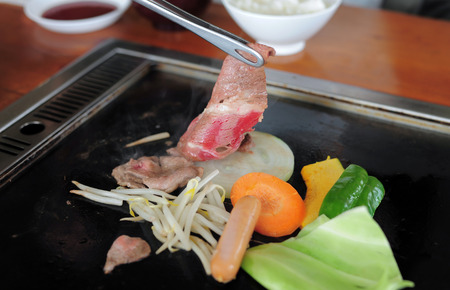 Raw beef slice Grilled on hot plate , Yakiniku Japanese Foodの写真素材