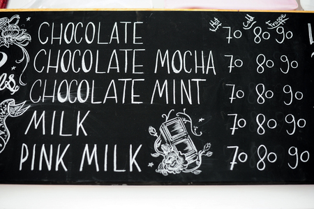 Hand drawing menu and prize in cake shop Thailandの写真素材