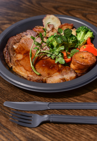 Steak in plastic plate ready to eatの写真素材