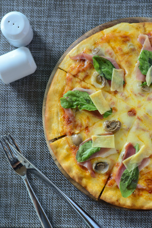 Gourmet Italian pizza on tableの写真素材