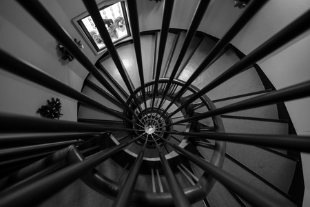 Looking down a spiral stair caseの写真素材