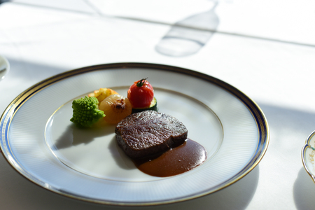 Grilled steak in white plateの写真素材