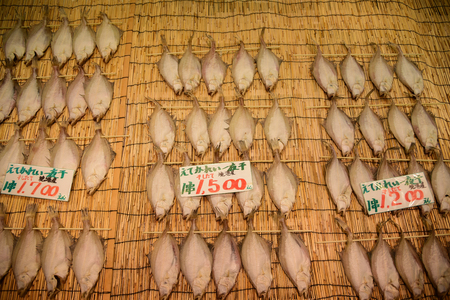 Dried fishs with price tag in the japannese market for saleの写真素材