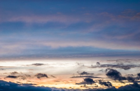 Beautiful aerial view above clouds with sunset.の写真素材