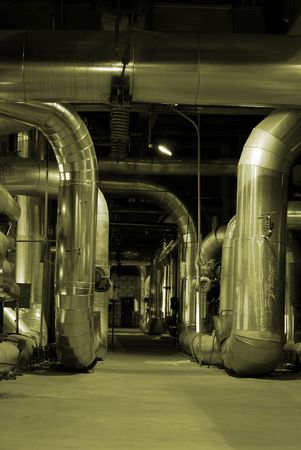 An assortment of different size and shaped pipes at a power plant         
