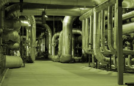 Pipes and tubes and chimney at a power plant          