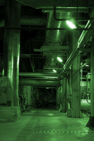 Pipes and tubes and chimney at a power plant      の写真素材