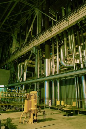 Equipment, cables and piping as found inside of a modern industrial power plant