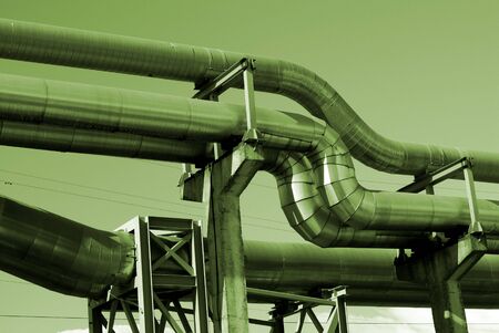 industrial pipelines on pipe-bridge against sky             の写真素材