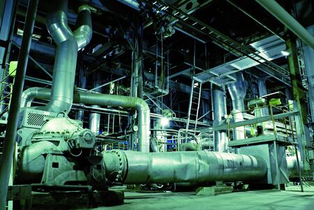 Equipment, cables and piping as found inside of a modern industrial power plant.           