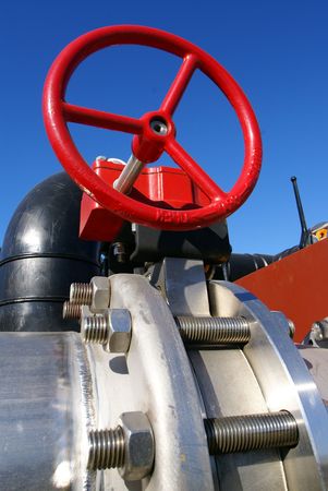 industrial pipelines on pipe-bridge against blue sky