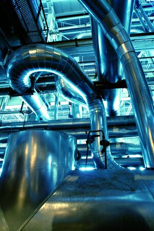 different size and shaped pipes at a power plant          の写真素材