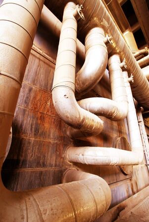 Pipes, tubes, machinery and steam turbine at a power plant                     