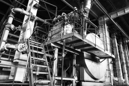Equipment, cables and piping as found inside of a modern industrial power plant b&w                   の写真素材