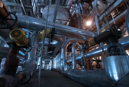 Pipes, tubes, machinery and steam turbine at a power plant       