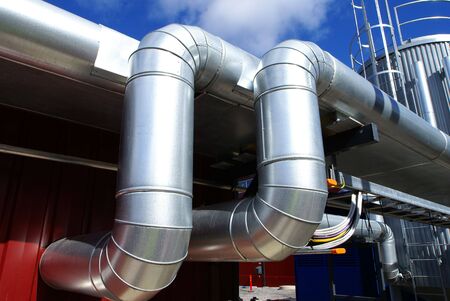 Industrial zone, Steel pipelines on blue sky                 