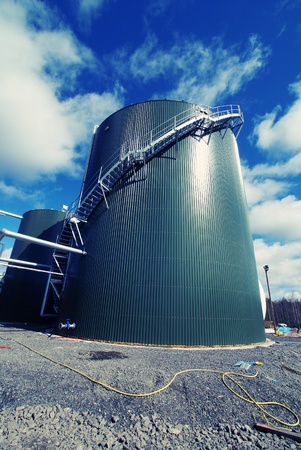 Industrial zone, Steel pipelines and tanks against blue sky                の写真素材