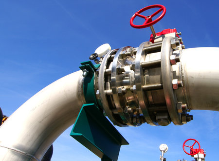 Industrial zone, Steel pipelines and valves against blue skyの写真素材