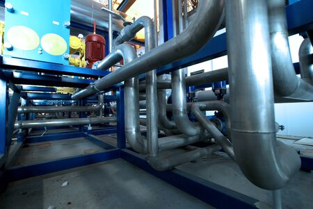 Equipment, cables and piping as found inside of  industrial power plant