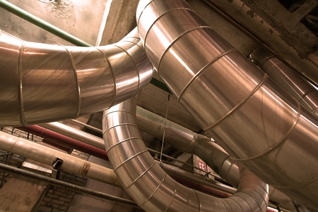 Equipment, cables and piping as found inside of  industrial power plant