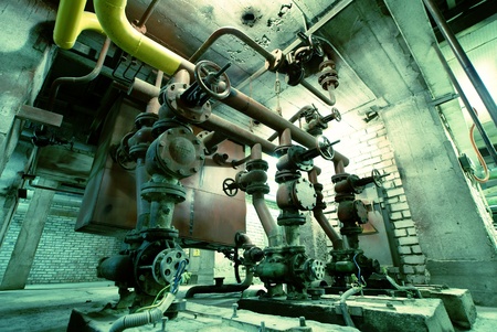 Equipment, cables and piping as found inside of a modern industrial power plant                   